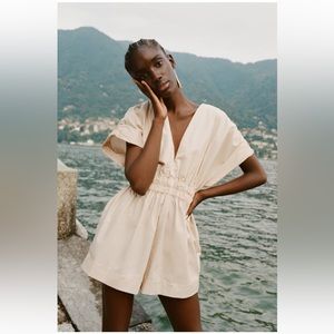 New without tags. Never worn. Zara short pleated jumpsuit.